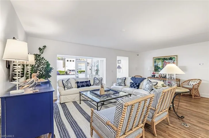 Living room featuring wood finished floors and baseboards