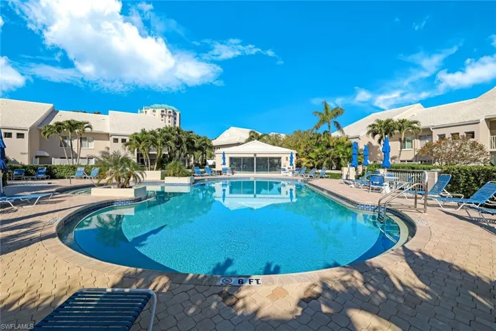 Community pool with a patio area
