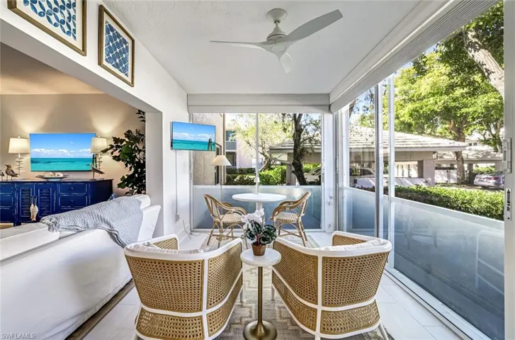 Sunroom featuring ceiling fan