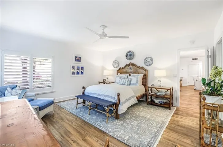 Bedroom with wood finished floors and a ceiling fan