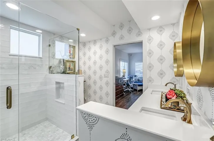 Full bathroom with a stall shower, vanity, dark wood finished floors, and recessed lighting