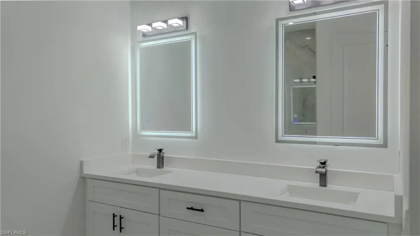 Bathroom featuring double vanity