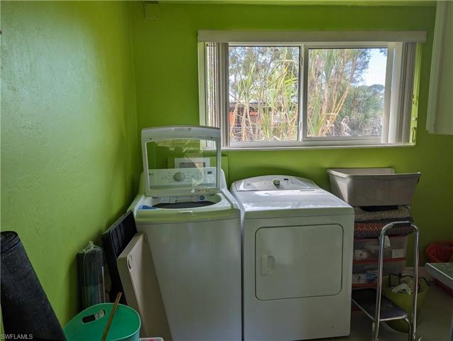 Laundry room in Detached Carport, Includes freezer and mop sink, and portable AC