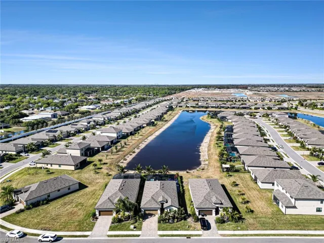 Aerial perspective of suburban area with a large body of water