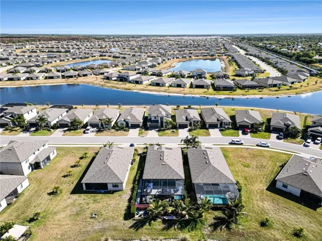 View of property location with nearby suburban area and a large body of water
