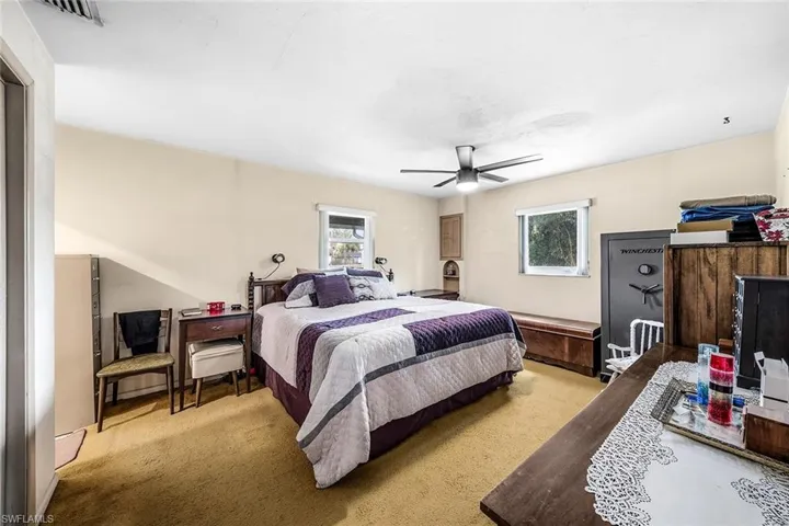 Bedroom with carpet floors and a ceiling fan