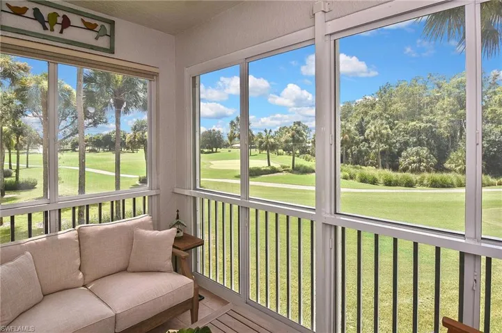 Sunroom with view of golf course