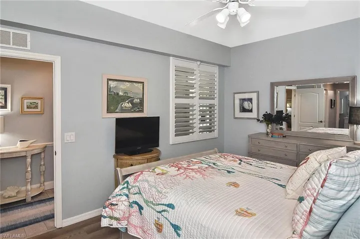 Bedroom with wood finished floors and ceiling fan