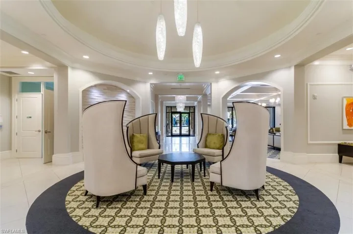 Building lobby with recessed lighting and ornamental molding