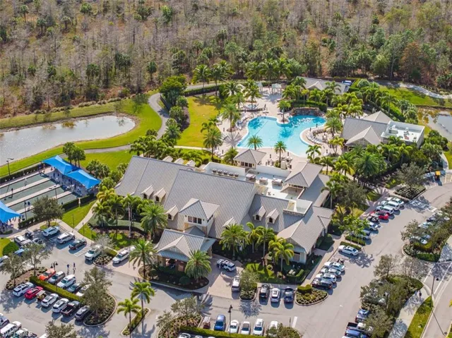 Aerial view of a pool and a nearby body of water
