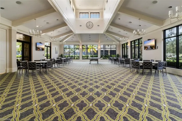 Community lobby featuring beam ceiling and high vaulted ceiling