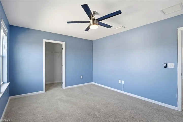 bedroom featuring carpet, and a ceiling fan