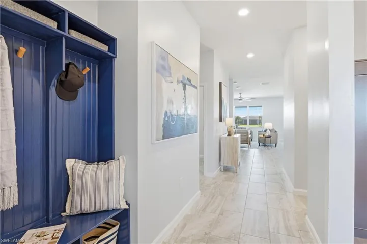 Hall featuring baseboards and recessed lighting