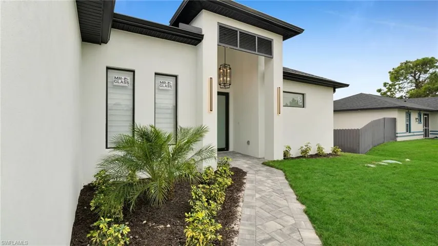 Entrance to property featuring stucco siding