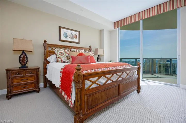 Bedroom featuring carpet and access to outside