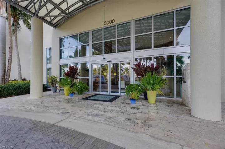 View of exterior entry with stucco siding, french doors, and a patio area