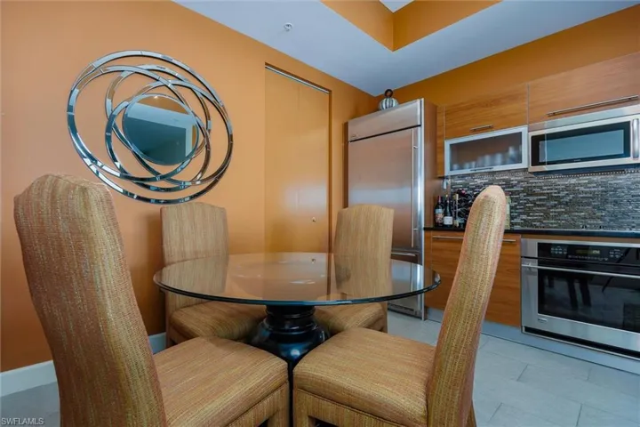 Dining area featuring light tile patterned flooring