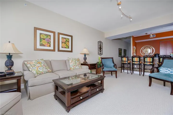 Carpeted living room with baseboards