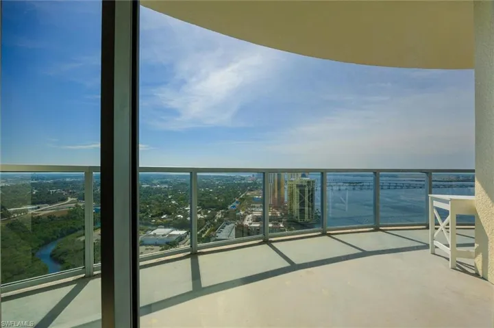 Balcony with a city view and a water view