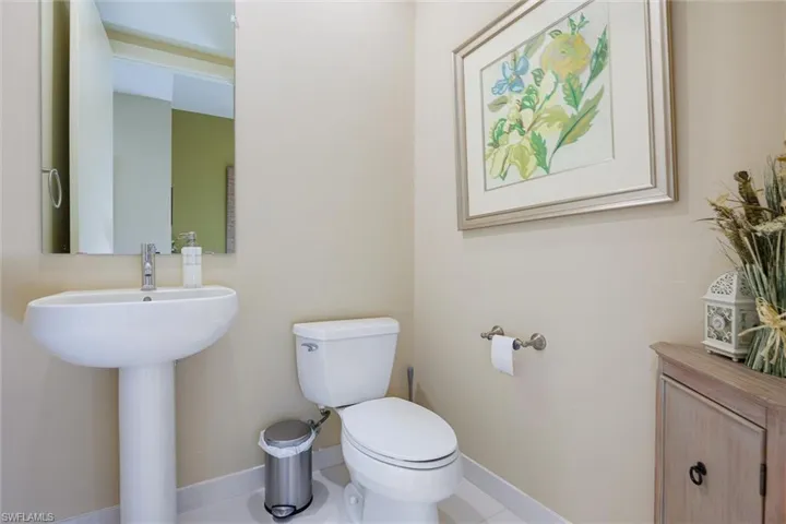 Bathroom with toilet and tile patterned flooring