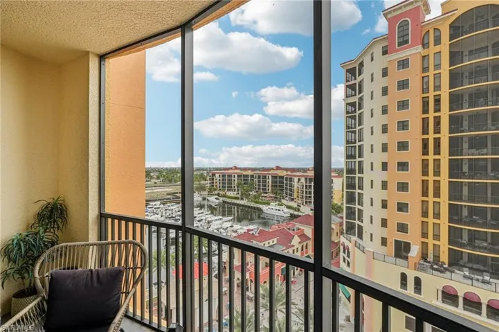 Balcony featuring a sunroom