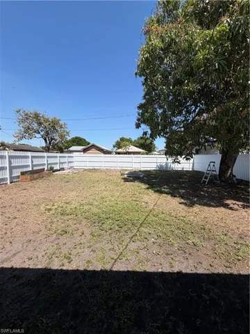 View of fenced backyard