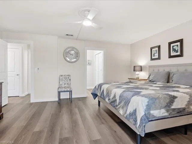 Bedroom with wood finished floors and a ceiling fan