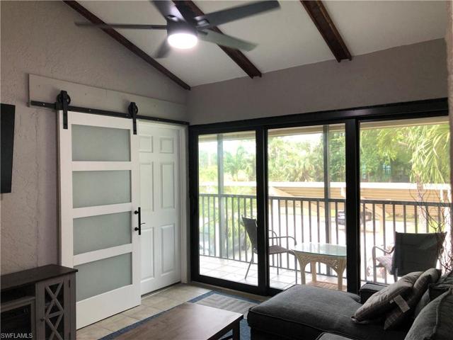 DEN W/HURRICANE SLIDER TO SCREENED BALCONY