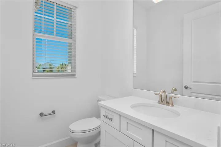 Half bath with vanity and toilet