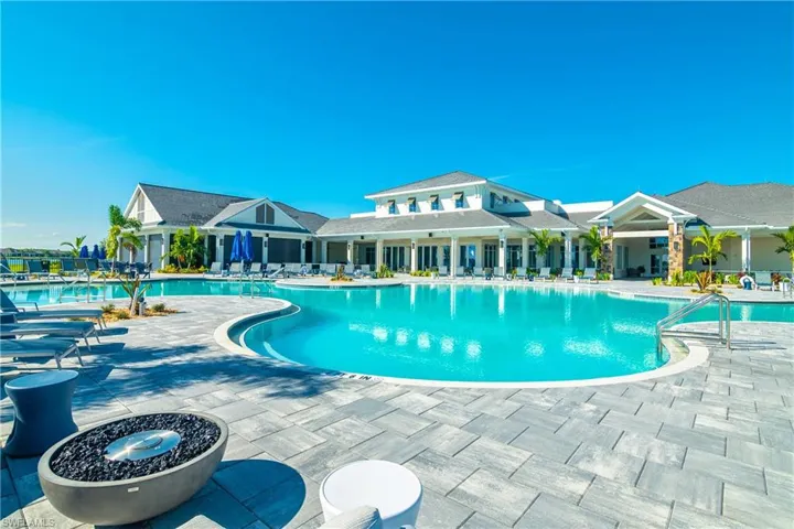 Community pool with a patio