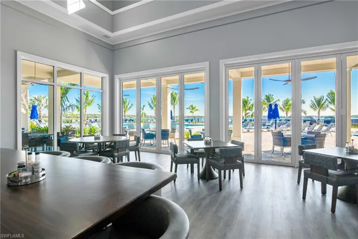 Dining room with healthy amount of natural light and light wood finished floors