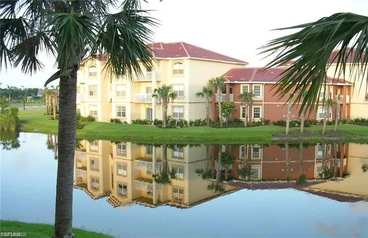 View of apartment building / complex with a water view