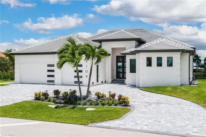 Contemporary white stucco exterior with a gray tile roof