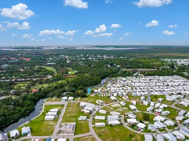 View of property location with nearby suburban area and a large body of water