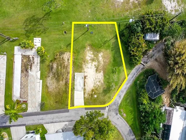 Aerial view of property and surrounding area with property boundaries highlighted