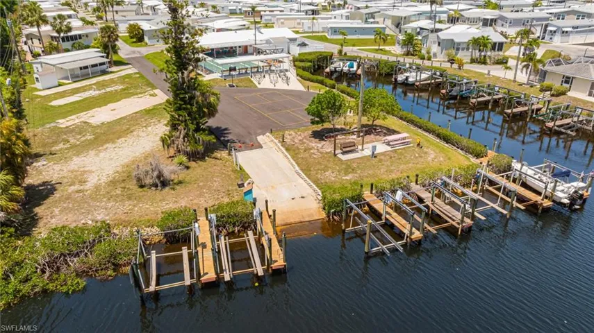 Aerial perspective of suburban area with a nearby body of water