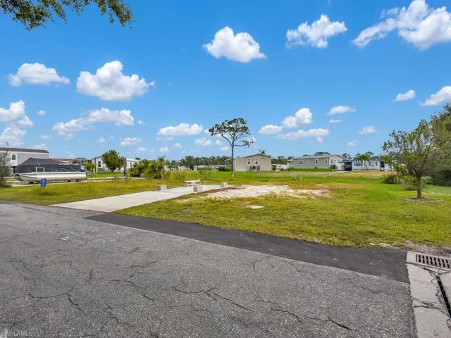 View of grassy yard featuring a residential view