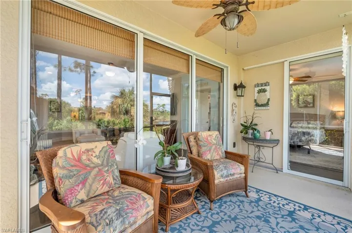 Sunroom / solarium with ceiling fan and a healthy amount of sunlight