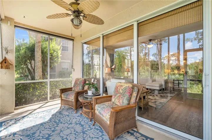 Sunroom / solarium featuring ceiling fan