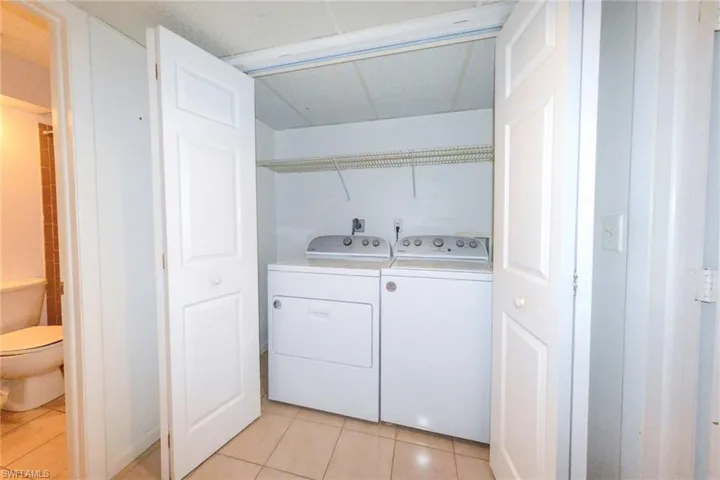Laundry room featuring separate washer and dryer
