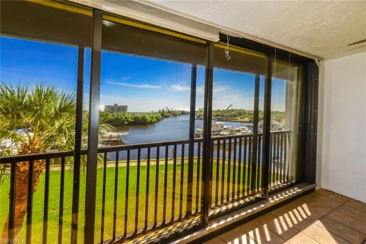 Unfurnished sunroom with a water view