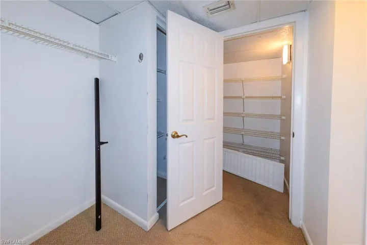 View of primary bedroom closet