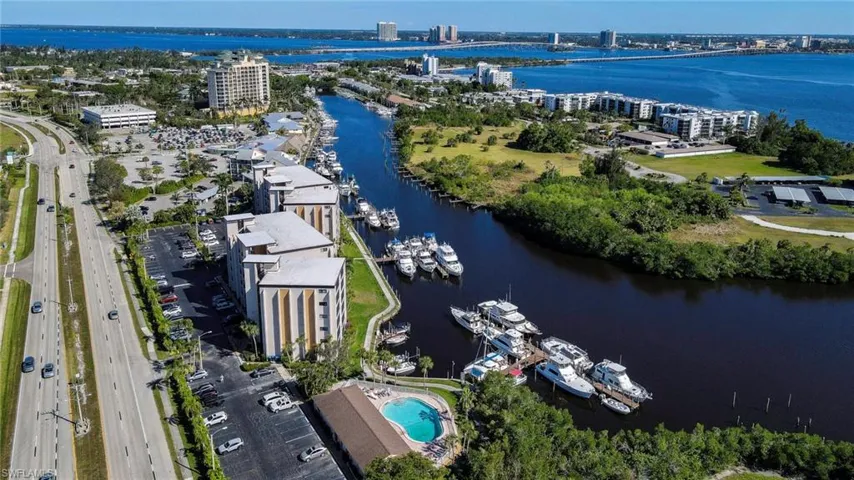 Birds eye view of property with a water view