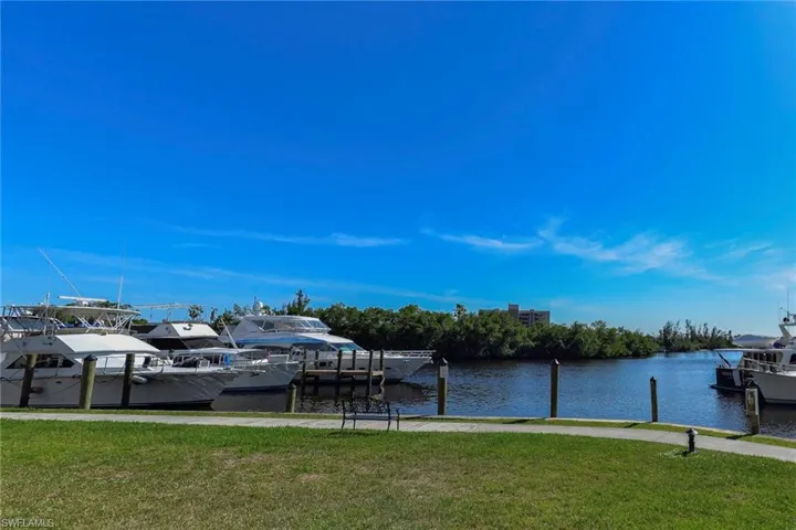 Dock area featuring a water view and  yard