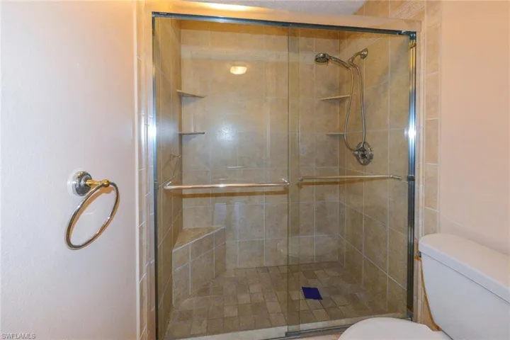 Bathroom with an enclosed shower and toilet