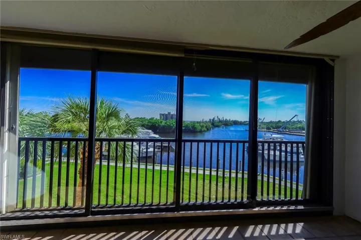 Unfurnished sunroom featuring a water view