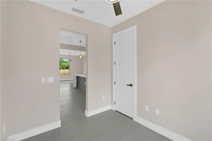 Spare room featuring light wood finished floors and ceiling fan
