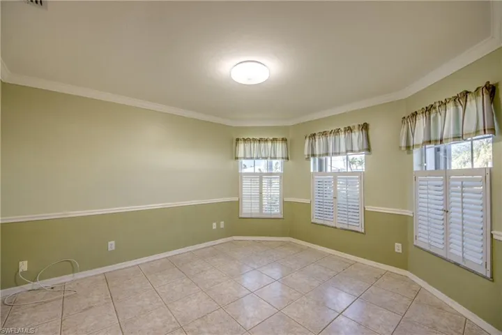 Tiled empty room with ornamental molding