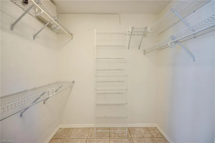 Spacious closet featuring light tile patterned floors