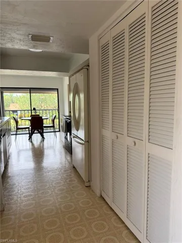 White louvered bifold doors offering extensive storage space
